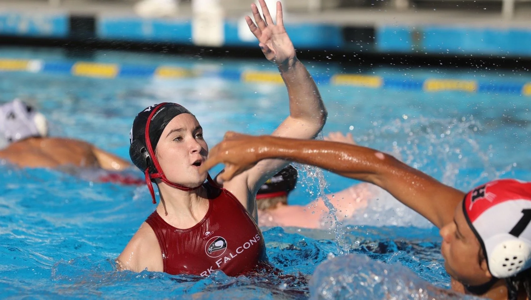 girls water polo player in pool
