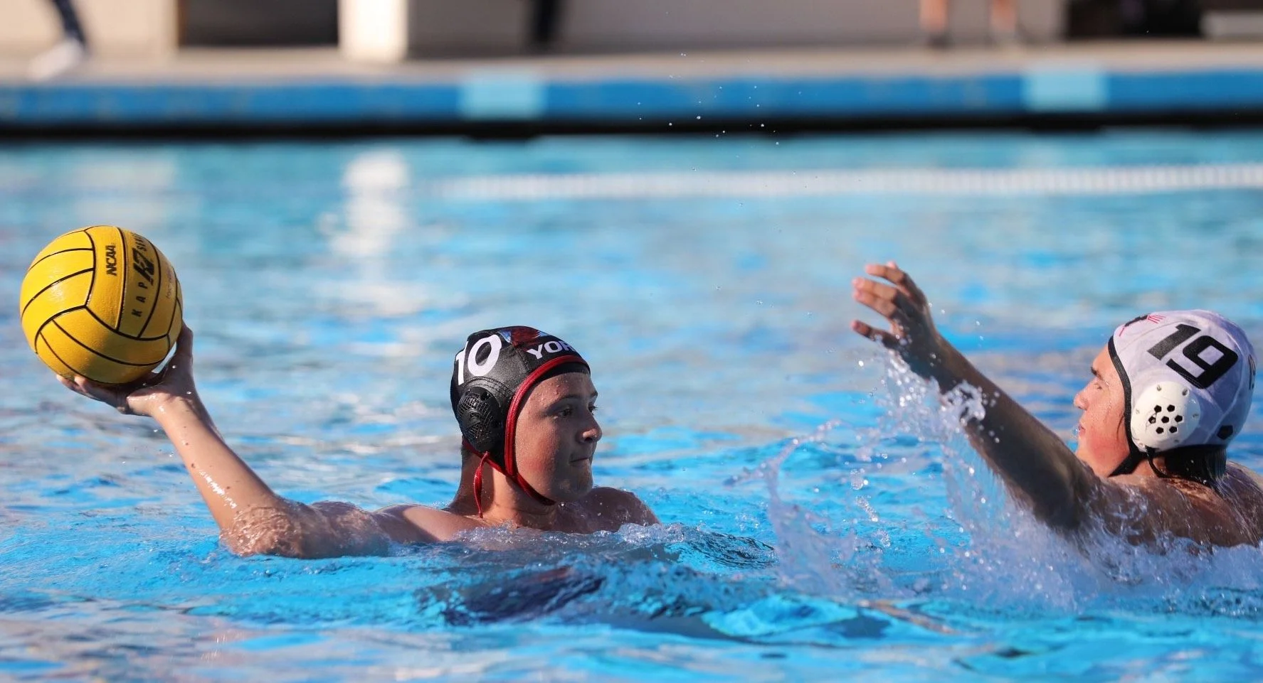 boys water polo player in pool