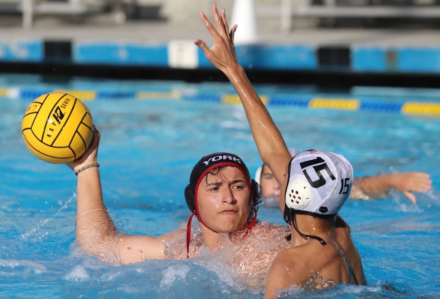 boys water polo game in pool