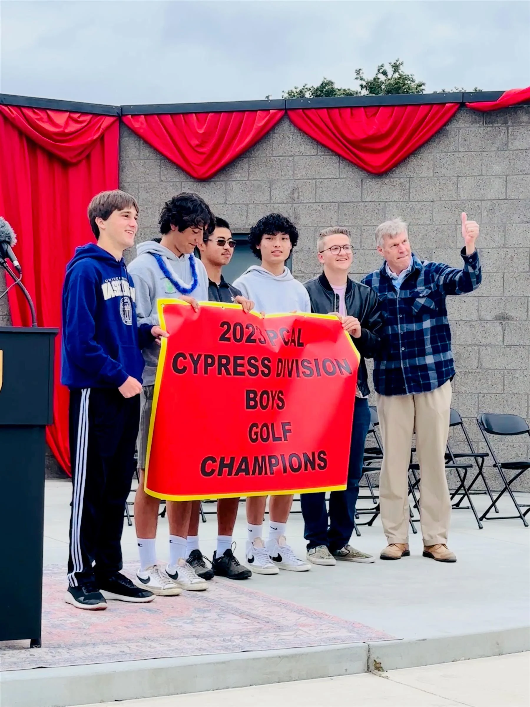 York golf team holding award banner