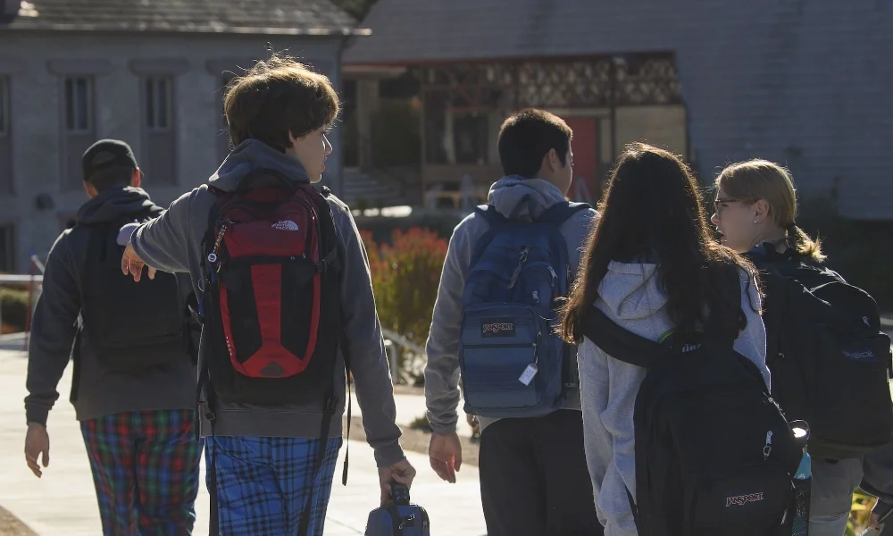 group of York students walking with backpacks on
