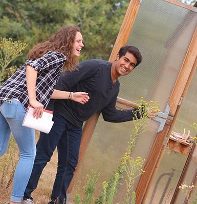 two students in outdoor lab